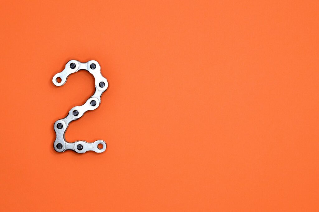 Gray Steel Chain on Orange Surface